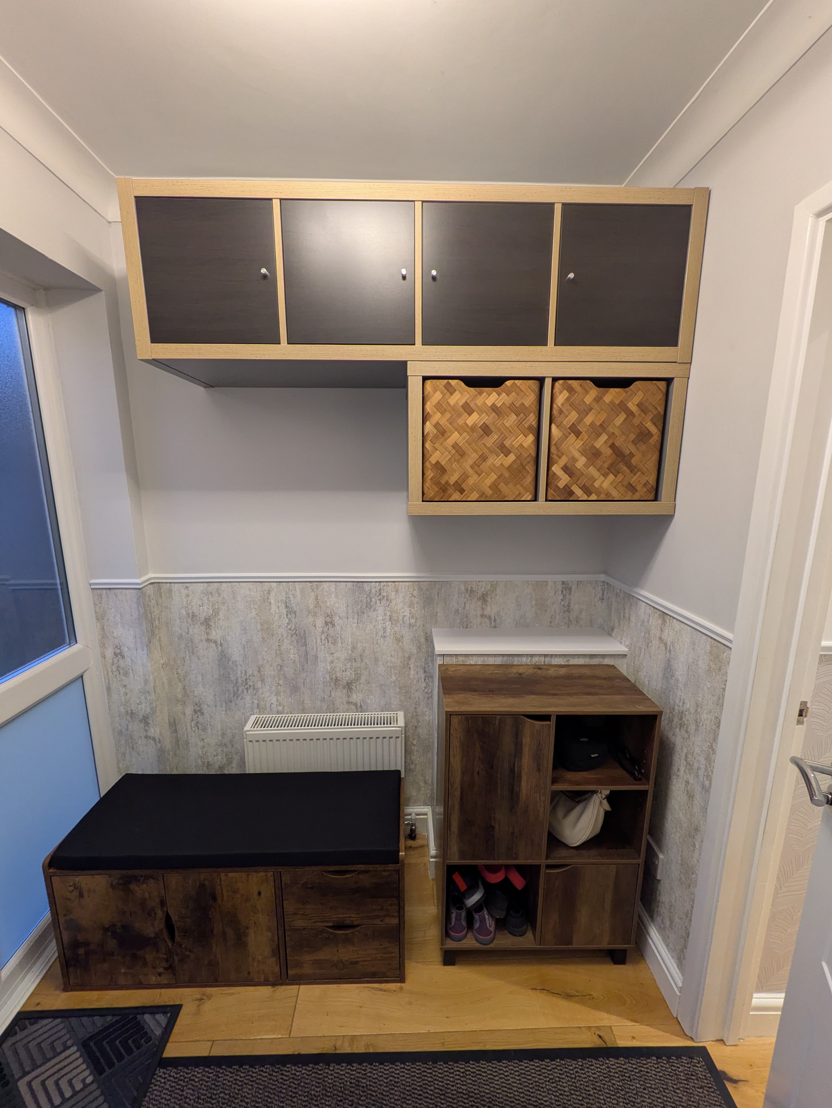 Entryway storage build with bench and overhead cabinets